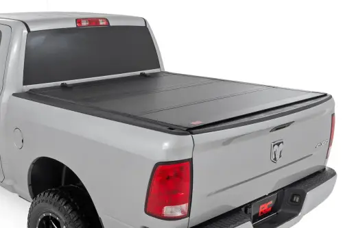 Rough Country - 49318650 | Rough Country Hard Tri-Fold Flip Up Tonneau Bed Cover For Ram 1500 (2010-2018 / 2500 (2010-2023) | 6'4" Bed