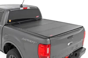49220500 | Rough Country Hard Tri-Fold Flip Up Tonneau Bed Cover For Ford Ranger 2WD/4WD | 2019-2023 | 5' Bed