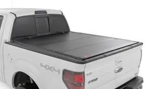 Rough Country - 49214550 | Rough Country Hard Tri-Fold Flip Up Tonneau Bed Cover For Ford F-150 2WD/4WD | 2004-2014 | 5'7" Bed - Image 1