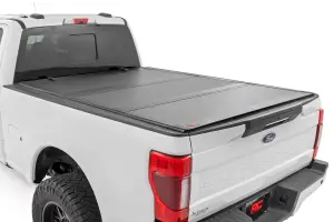 49220651 | Rough Country Hard Tri-Fold Flip Up Tonneau Bed Cover For Ford F-250/F-350 Super Duty | 2017-2023 | 6'10" Bed