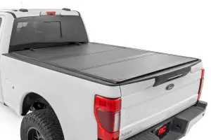 49220651 | Rough Country Hard Tri-Fold Flip Up Bed Cover (2017-2024 F250, F350 Super Duty 2WD/4WD | 6'10" Bed)