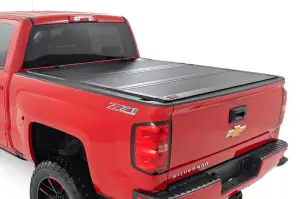 49119551 | Rough Country Hard Tri-Fold Flip Up Tonneau Bed Cover For Chevrolet Silverado / GMC Sierra 1500/2500 HD/3500 HD | 2014-2019 | 5' 9" Bed With Rail Clips