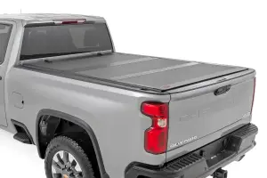 49120651 | Rough Country Hard Tri-Fold Flip Up Bed Cover (2020-2025 Silverado, Sierra 2500 HD, 3500 HD 2WD/4WD | 6'9" Bed)