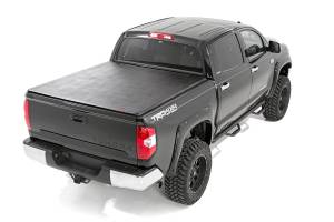 Rough Country - 41419550 | Rough-Country Bed Cover | Tri Fold | Soft | 5'7" Bed | No OE Rail | Toyota Tundra (07-24) - Image 1