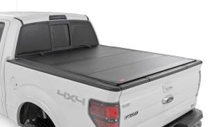 49214650 | Rough Country Hard Tri-Fold Flip Up Bed Cover (2004-2014 F150 Pickup 2WD/4WD | 6'7" Bed)