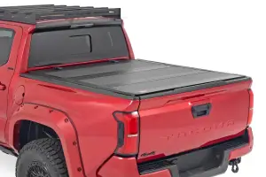 49415551 | Rough Country Hard Tri Fold Flip Up Bed Cover (2024-2025 Tacoma 2WD/4WD | 5' Bed)