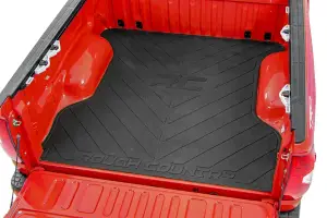 RCM685 | Rough Country Bed Mat With RC Logo (2019-2025 Ram 1500 2WD/4WD | 2021-2025 Ram 1500 TRX AWD | 5'7" Bed)