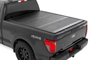 47229650B | Rough Country Hard Low Profile Bed Cover For Ford F150 / F-150 Raptor, Tremor & Lightning | 6'7" Bed