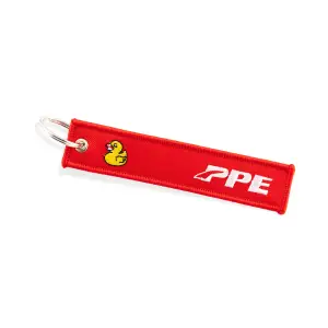 Pacific Performance Engineering - 588982802 | PPE Performance Remove Before Flight Key Chain | Red Fabric With White Embroidery & Yellow Ducky - Image 1