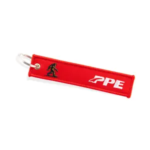 Pacific Performance Engineering - 588982806 | PPE Performance Remove Before Flight Key Chain | Red Fabric with White Embroidery & Sasquatch - Image 1